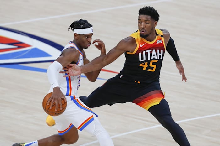 Donovan Mitchell (45) goes for a steal against the Oklahoma City Thunder